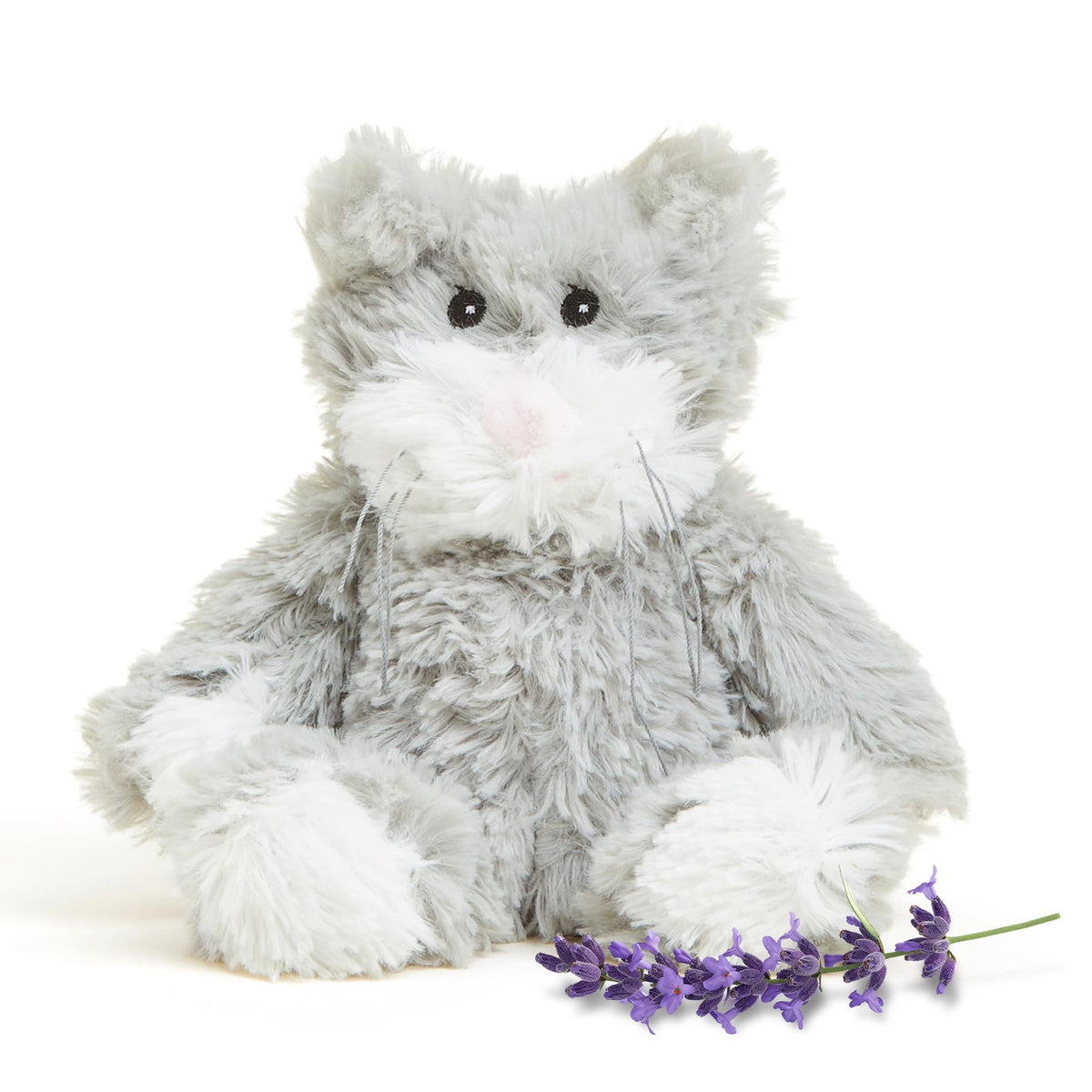 Warmies Junior Cat plush being heated for cozy bedtime warmth.