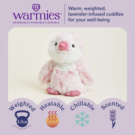 Warmies pink penguin heated demonstration showing microwave heat for warmth.