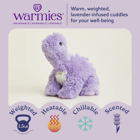 Warmies purple long-neck dinosaur snuggles as a soft plush companion.