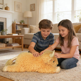 WDXDSOB Highland Cow plush in reading nook for cozy study sessions.
