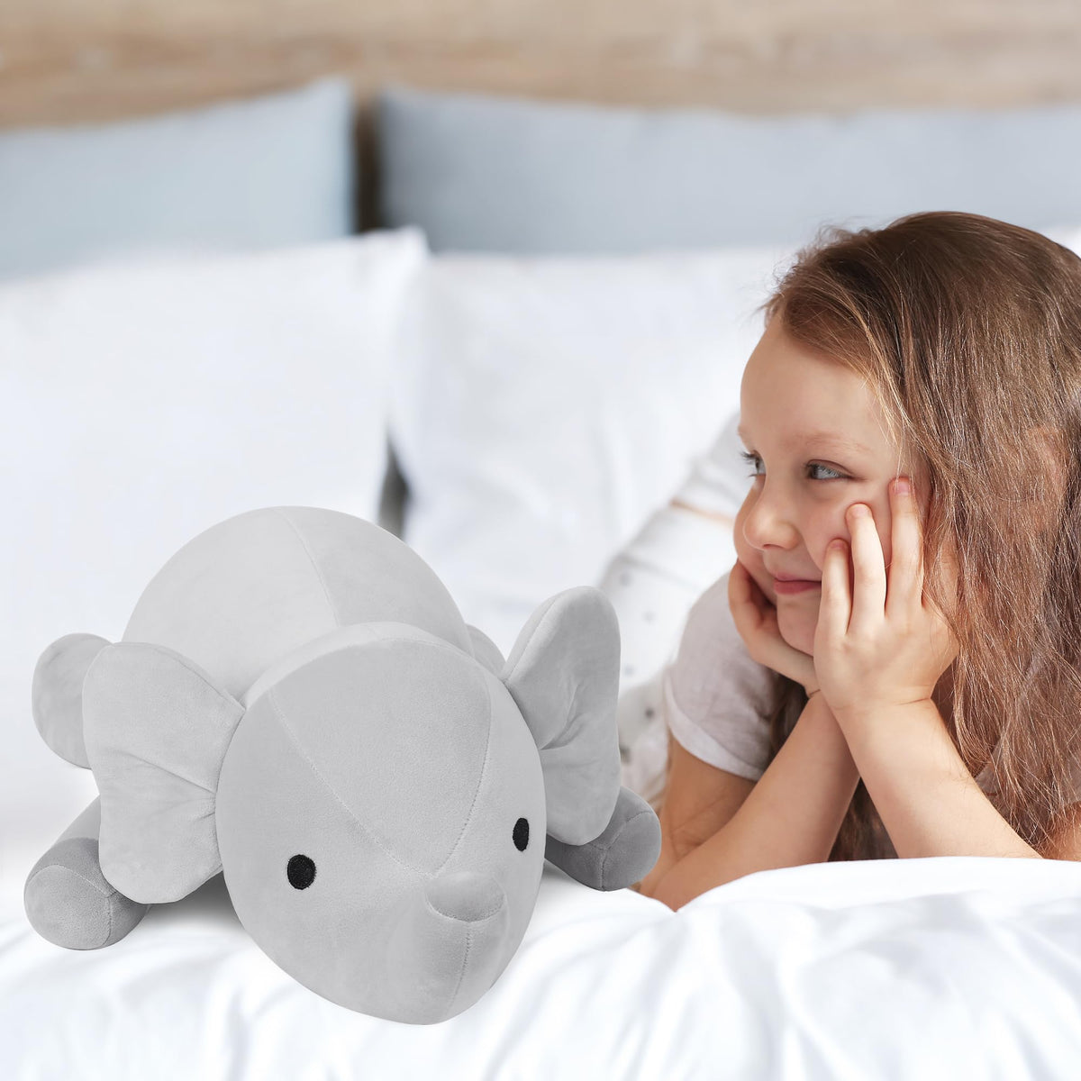 WeBingo weighted elephant used as decorative throw pillow to add cozy charm.