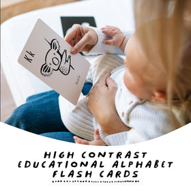 Wee Gallery high-contrast alphabet cards baby focus image supports longer attention during play.