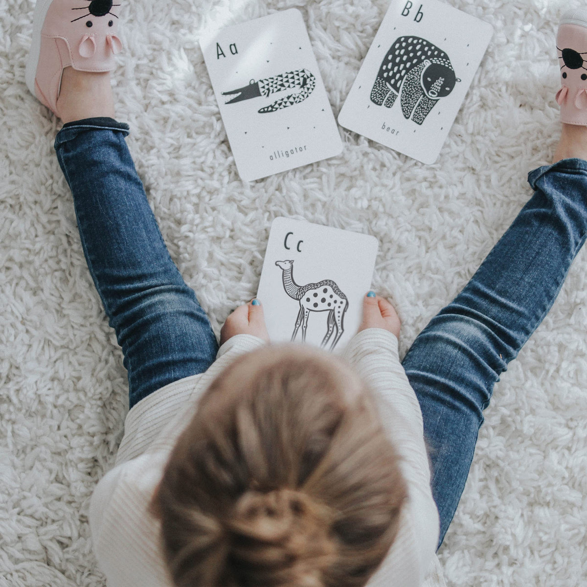 Wee Gallery high-contrast alphabet cards newborn-friendly option for calming language exploration.