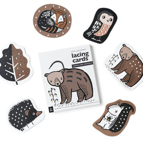 Wee Gallery Woodland Lacing Cards with forest animals for fine motor skill practice.