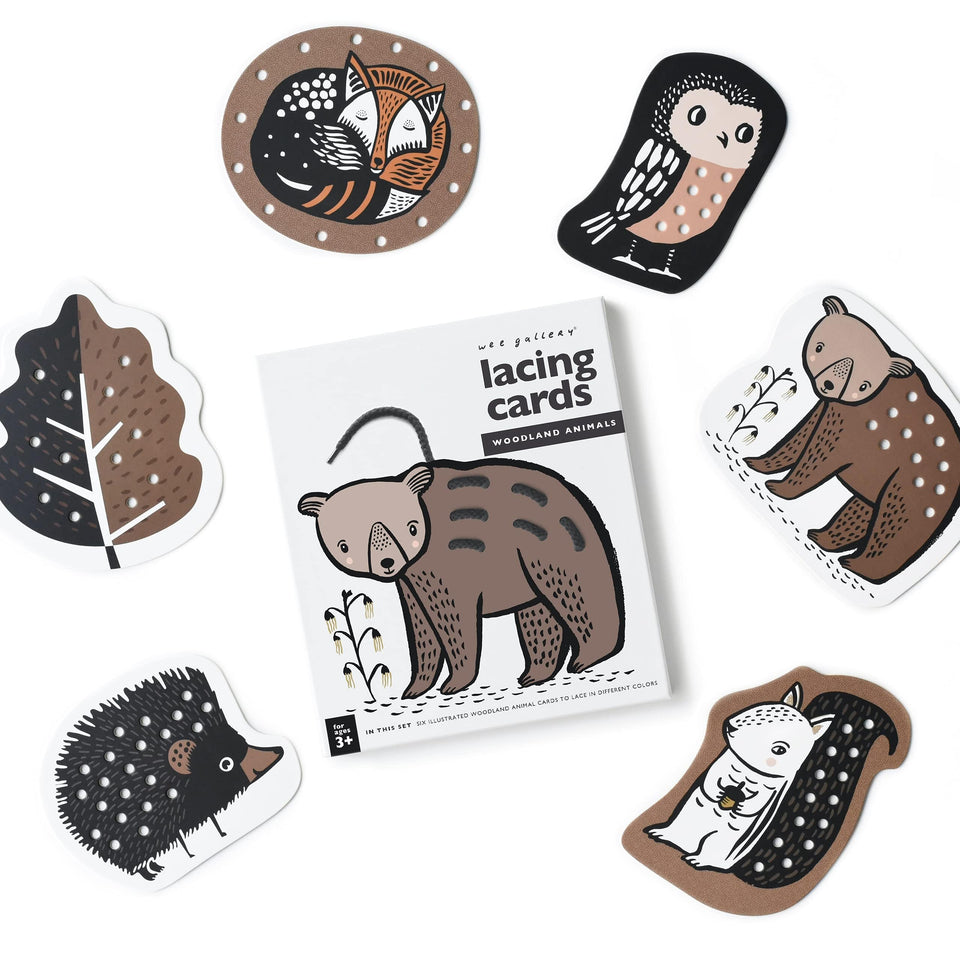 Wee Gallery Woodland Lacing Cards with forest animals for fine motor skill practice.