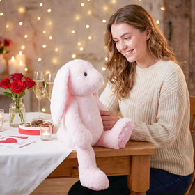 WEIGEDU pink rabbit serves as a bedtime companion.
