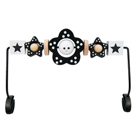 Welgep wooden toy bar attachment on a baby bouncer showing a secure install for safe play