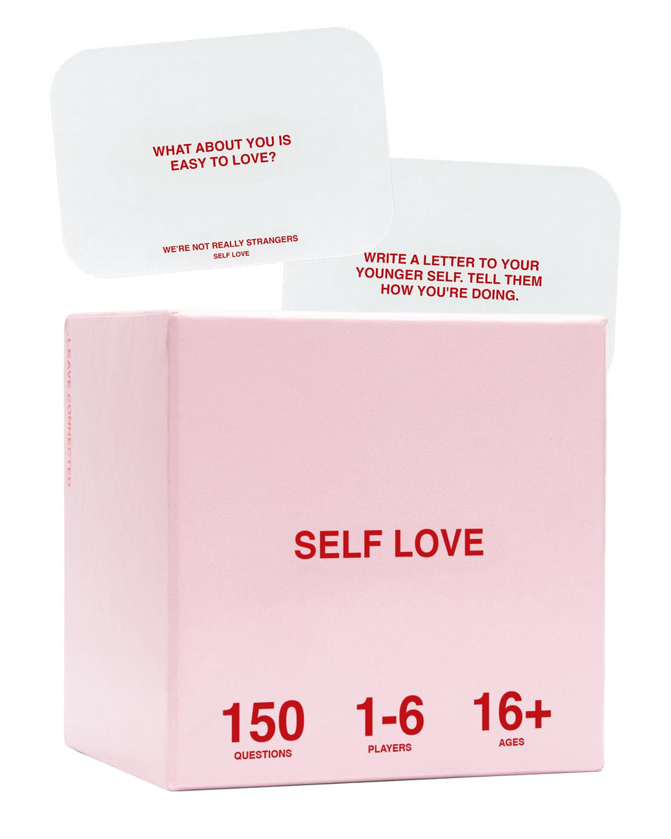 WE'RE NOT REALLY STRANGERS Self-Love Edition cards laid out for intimate self-reflection.