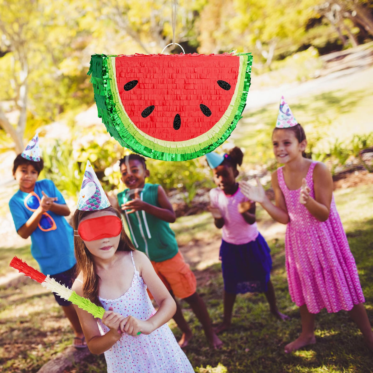 WERNNSAI Watermelon Pinata used as a photo prop at a summer party.