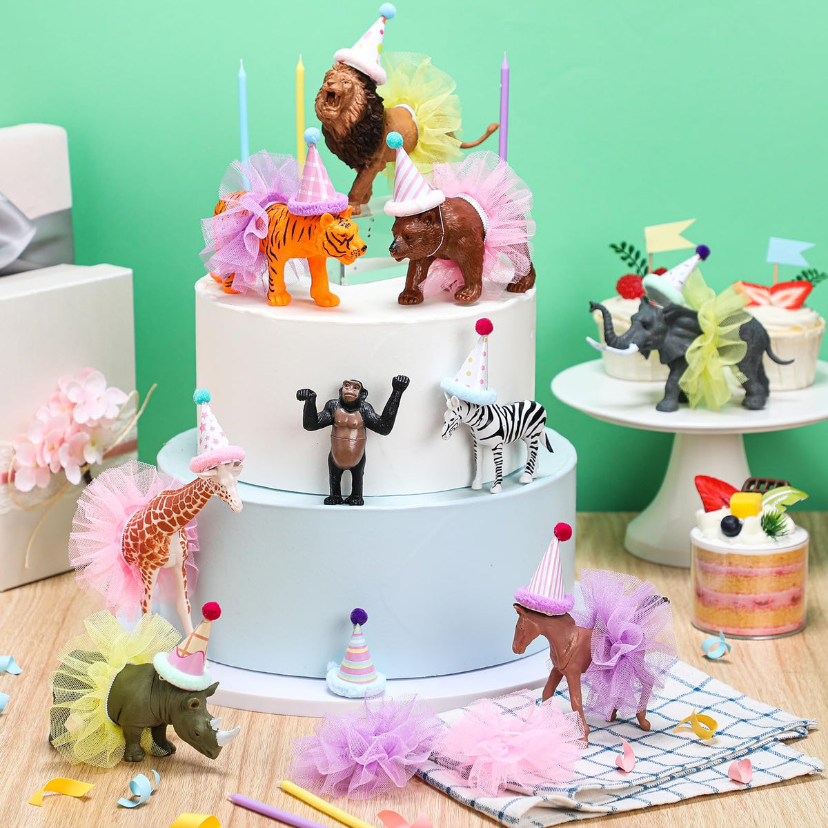 Weysat paper birthday hats add whimsy to jungle party decor.