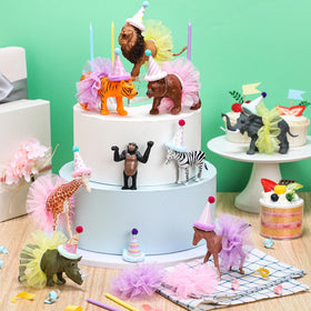 Weysat paper birthday hats add whimsy to jungle party decor.