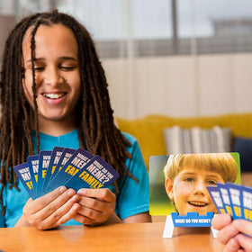 What Do You Meme? Family Edition caption cards spread sparks witty moments during gatherings.