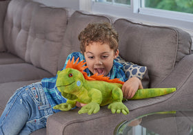 Wild Republic Iguana Plush in a child's arms for pretend play.