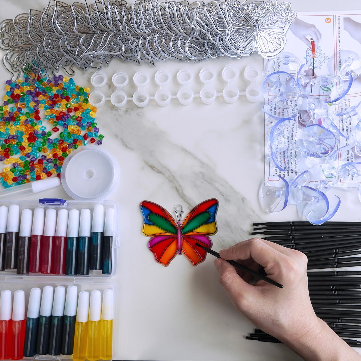 Winlyn empty paint pots keep paints organized for easy color planning.