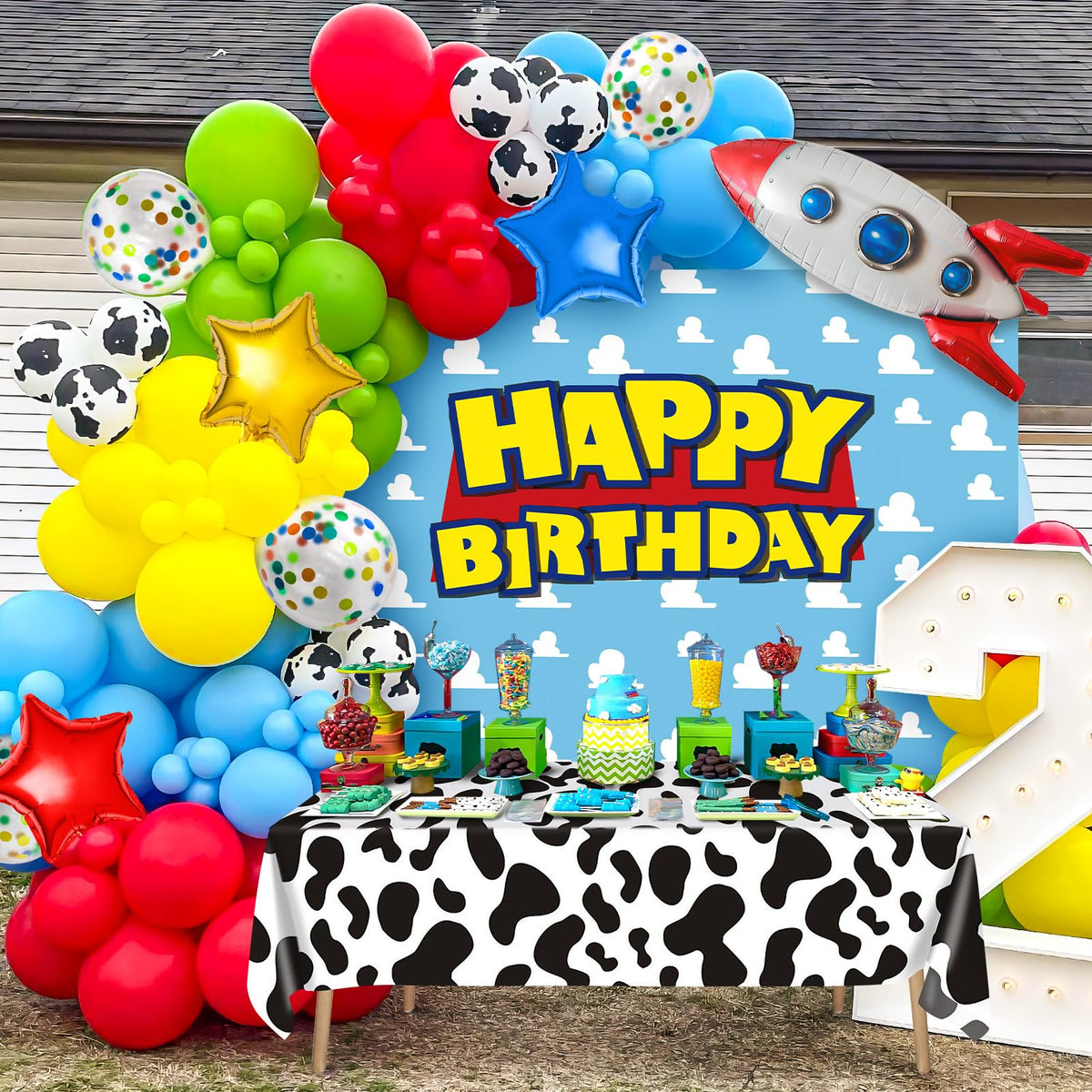 Winrayk cow-print tablecloth ties the theme together at tables