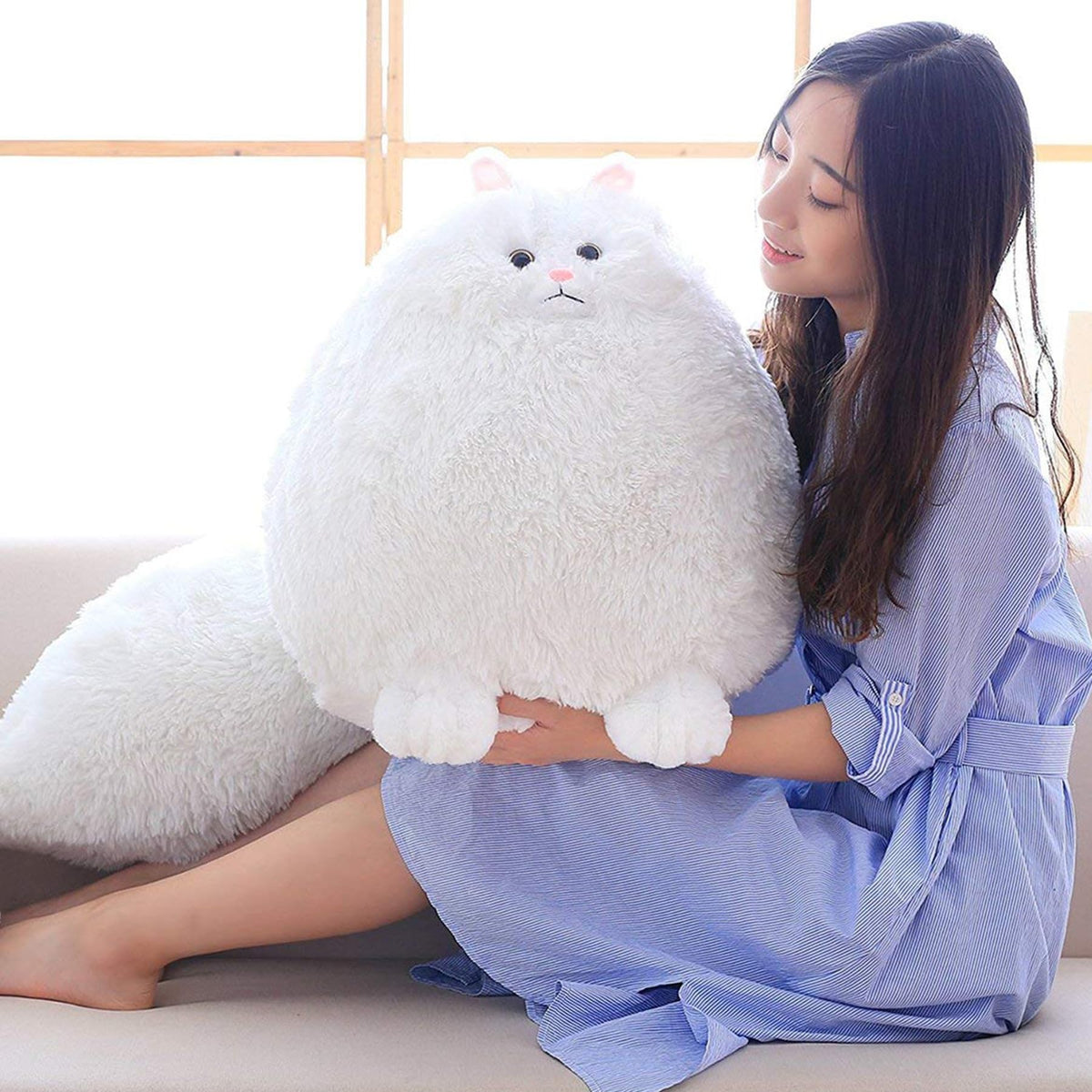 Close-up of Winsterch fluffy white cat plush showing soft fur and friendly face