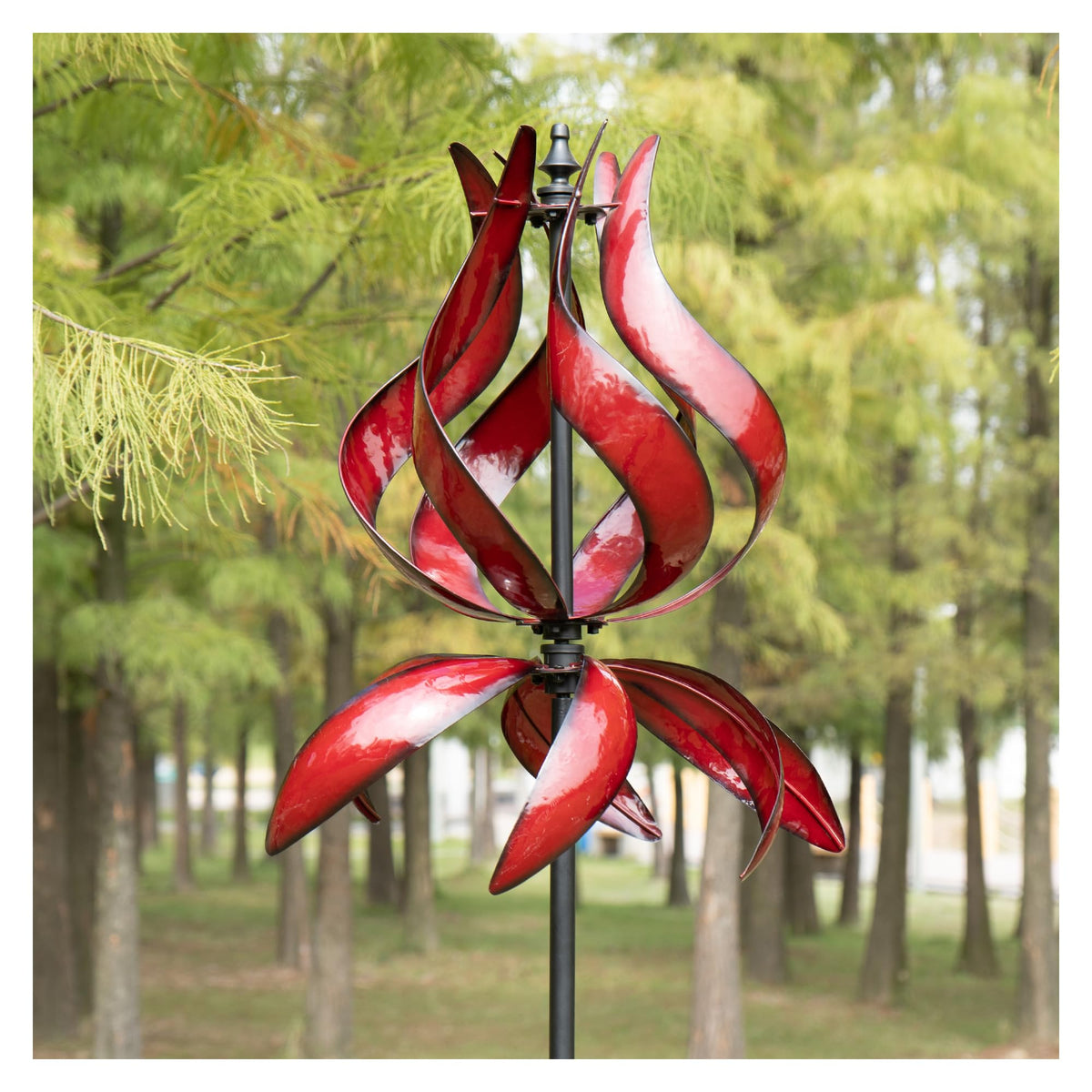 WinWindSpinner tulip wind spinner in burgundy adds dynamic color to sunlit garden