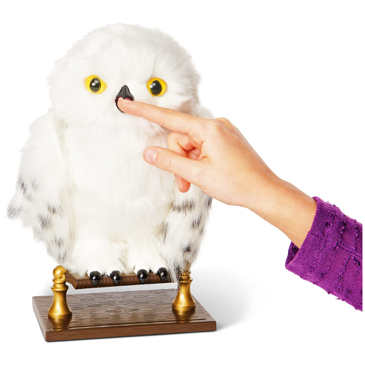 Wizarding World Enchanting Hedwig nibbling finger when happy.