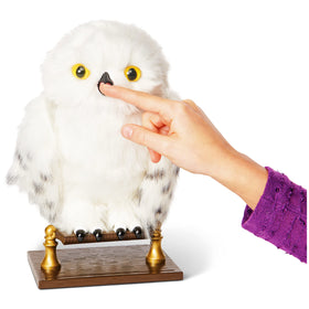 Wizarding World Enchanting Hedwig nibbling finger when happy.