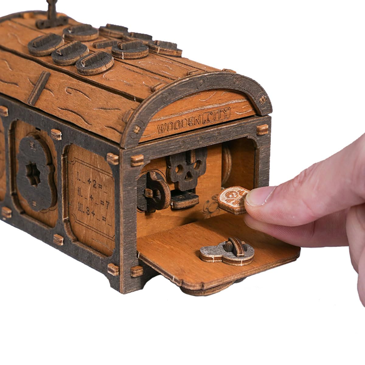 WOODEN.CITY Treasure Chest puzzle box in hand emphasizes portability and tactile feel.