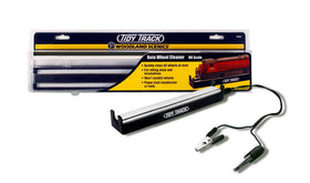 Woodland Scenics Tidy Track Roto Wheel Cleaner on a workbench for fast wheel cleaning.
