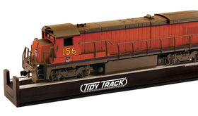 Woodland Scenics Tidy Track Roto Wheel Cleaner with an HO locomotive for quick maintenance.