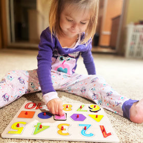 WOOODLIFY puzzles feature hidden pictures underneath pieces to aid matching.