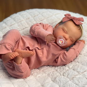 WOOROY realistic reborn doll sleeping in pink sleeper for imaginative play.