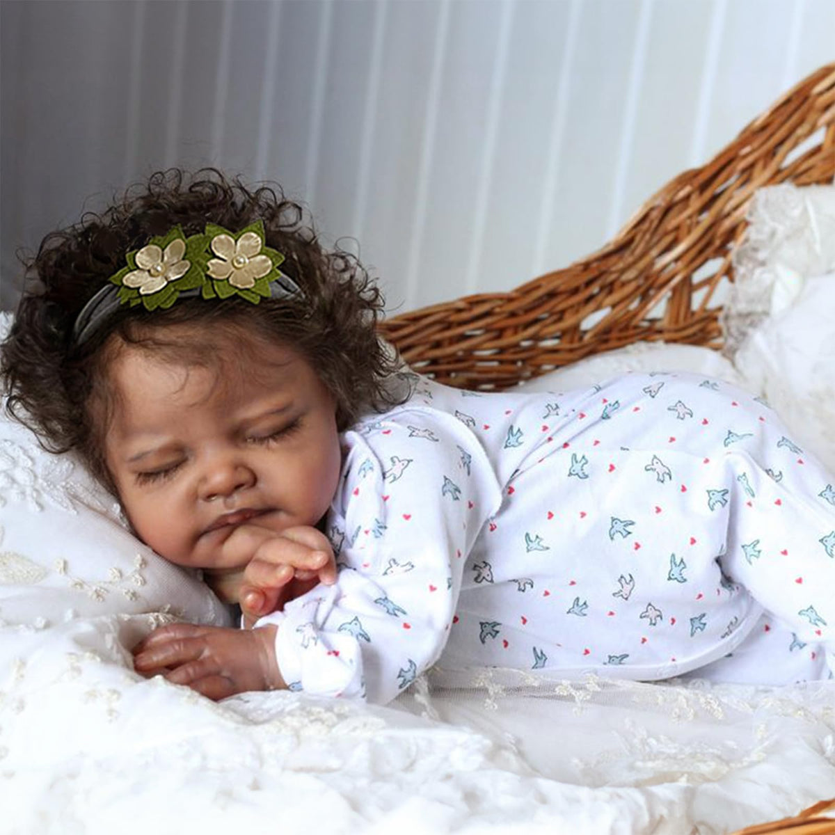 WOOROY August doll with green flower band showcases lifelike charm for calming play.