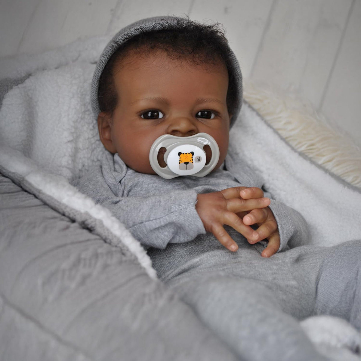 WOOROY soft-cloth body with vinyl limbs for authentic weight and feel
