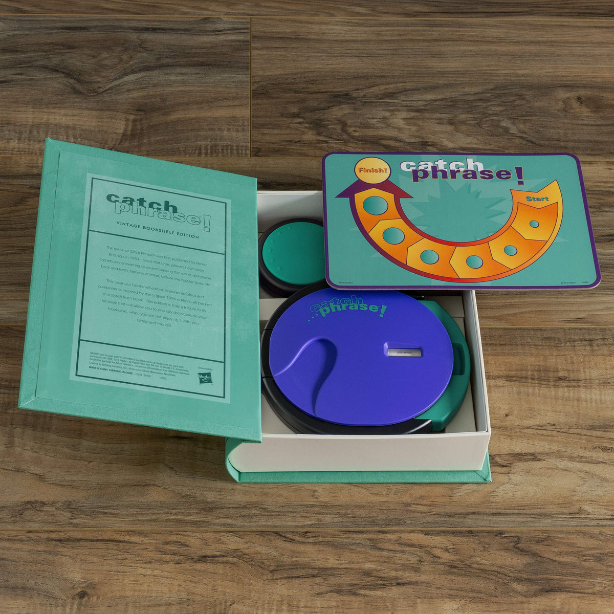 WS Game Company Catch Phrase disks spread reveals extensive word library for random play.