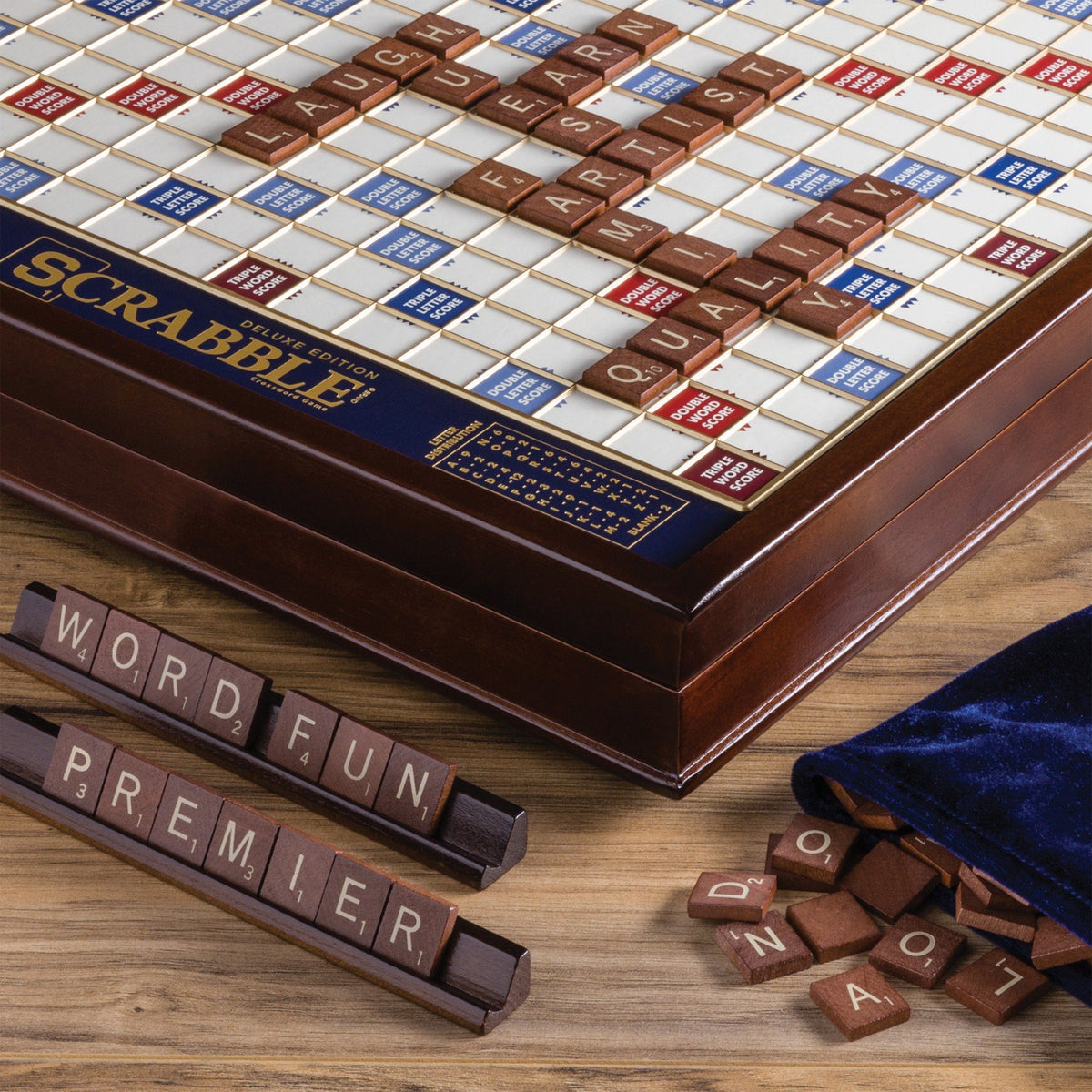 WS Game Company Scrabble Deluxe raised grid keeps tiles securely in place during play.