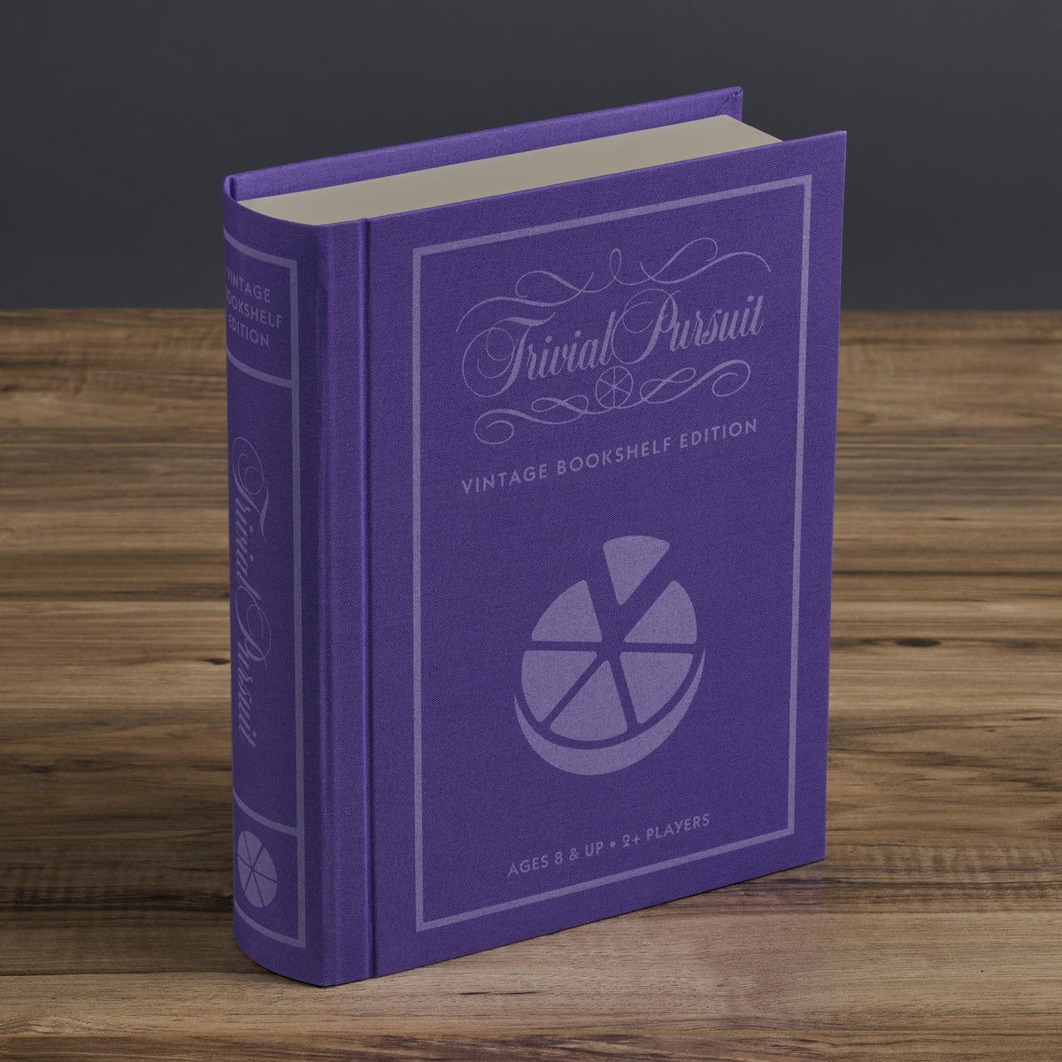 WS Game Company Trivial Pursuit Vintage Bookshelf Edition on display beside casual games