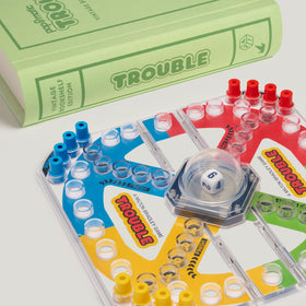 WS Game Company Trouble includes 16 pegs for familiar gameplay and easy setup