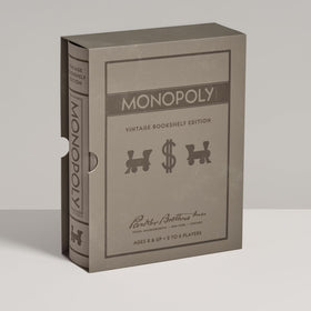 Wooden houses and hotels from WS Game Company Monopoly set for tactile gameplay