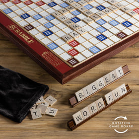 Oversized wooden tiles for tactile word building in Scrabble Giant Deluxe