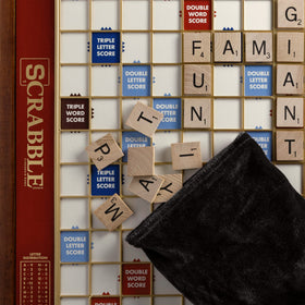 Velvet tile pouch stored with Scrabble Giant Deluxe components