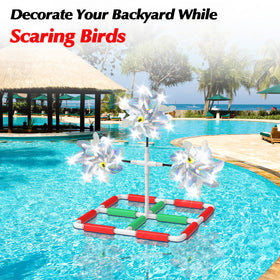 WSBXBB dock pond windmill deters birds with bright reflections near water.
