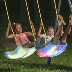 XDP Recreation Firefly LED light-up swing seat beside a porch enabling cozy evenings
