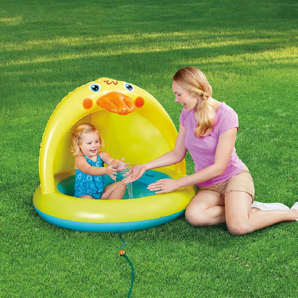 XFlated pool with sprinkler delivers refreshing mist for hot days.