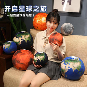 Teacher in classroom with space plush, supports engaging space lessons