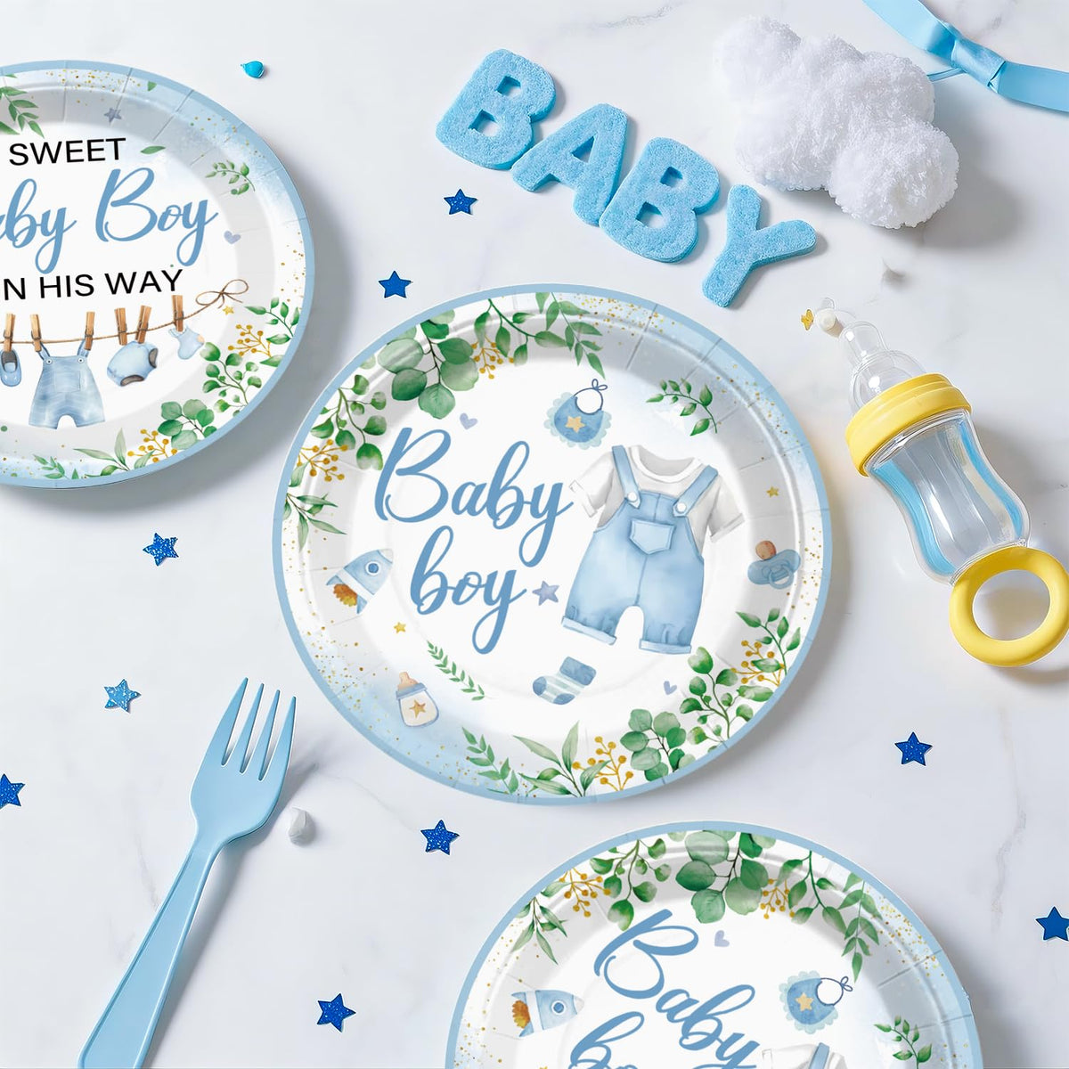 Xynic baby shower tablecloth protects surfaces with greenery decor.