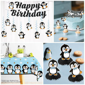 Xynic penguin foil balloons lift the decor with shiny accents.