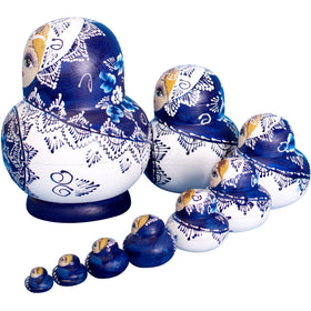 YAKELUS handmade Matryoshka dolls closeup — detailed hand-painted art on lime wood.