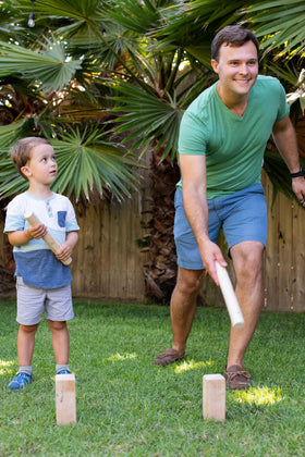 Yard Games Kubb backyard party scene showcases portable fun