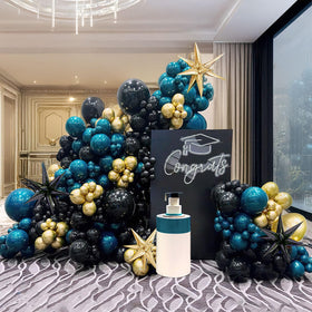 Yeewaka navy teal balloon garland backdrop ideal for elegant birthday or graduation party styling.