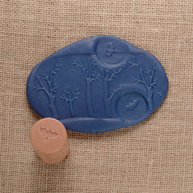 Yellow Door forest friends roller: squirrel and tree trunk supports counting and winding tales.