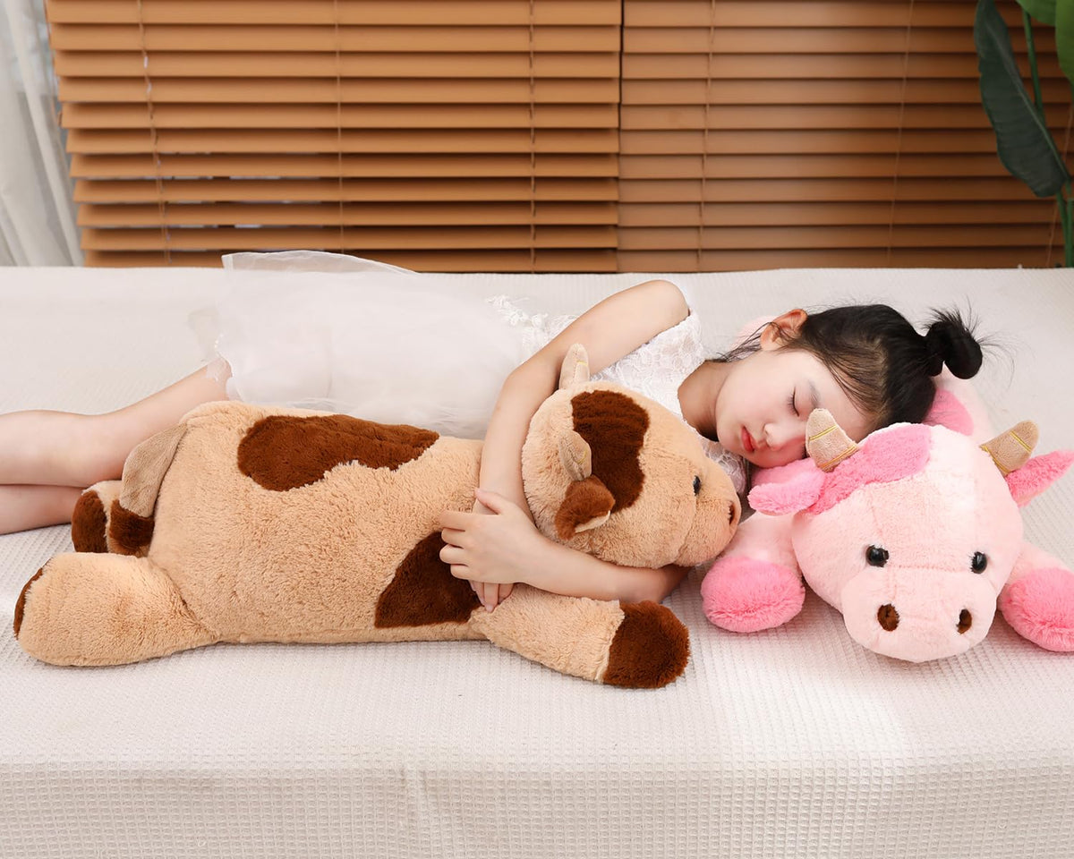 YESGIRL cow weighted plush held by child for cozy reading time.