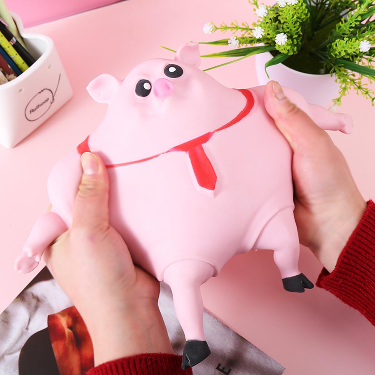 YJHWLF piglet extended stretch arms and legs for satisfying pull-and-resize play.