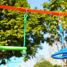 Ymeibe Ninja Wheel in action in a backyard obstacle course